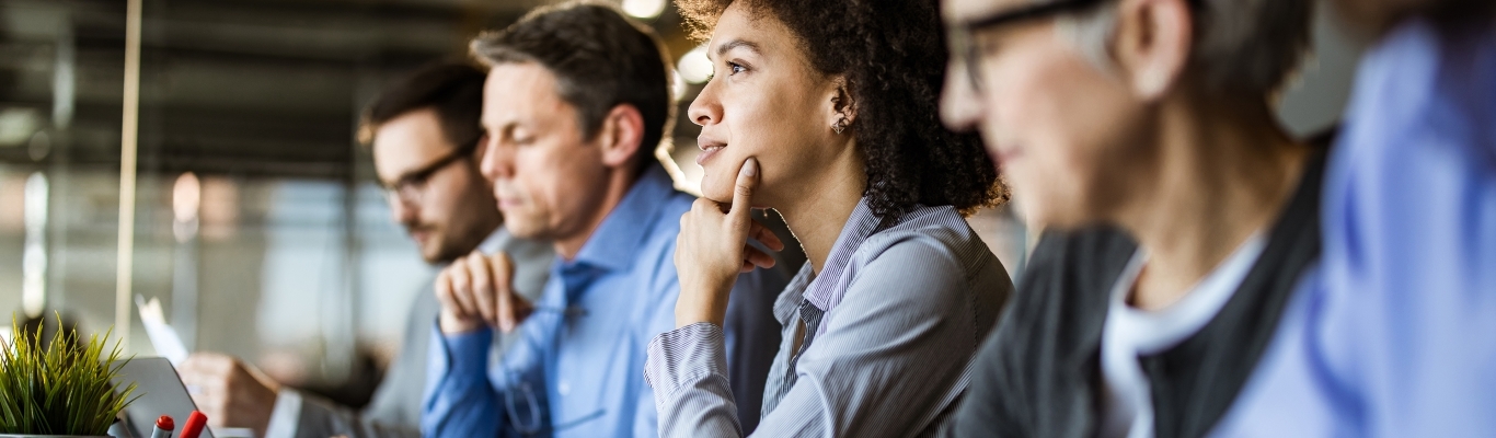 People sitting at table during meeting